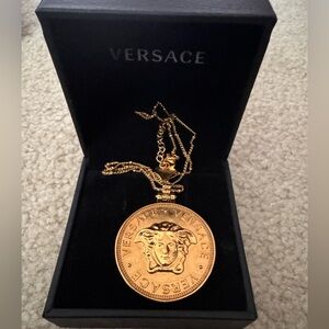 Versace gold coin Medusa necklace.